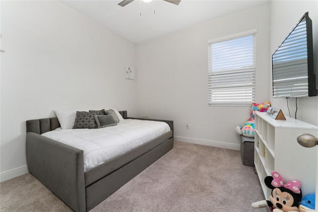 bedroom with light carpet and ceiling fan