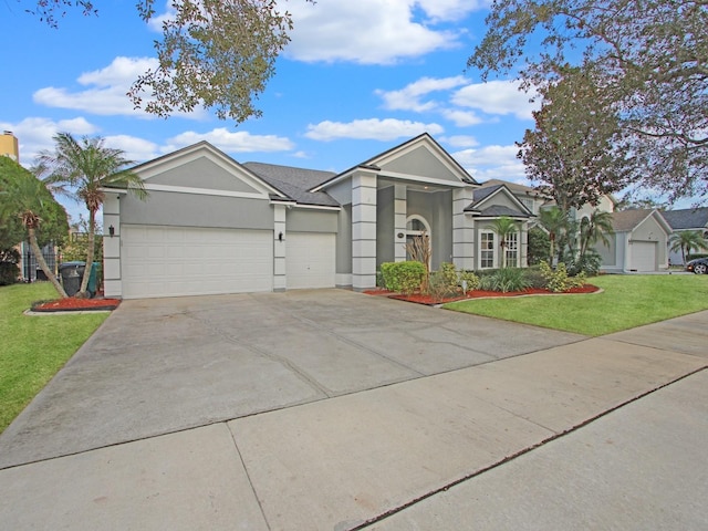 ranch-style house with a garage and a front yard