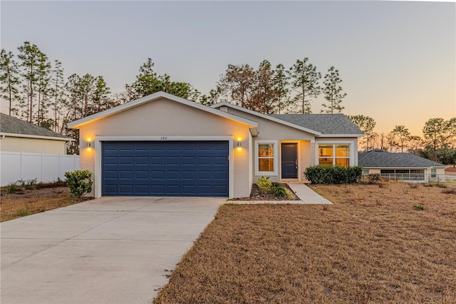 single story home with a garage