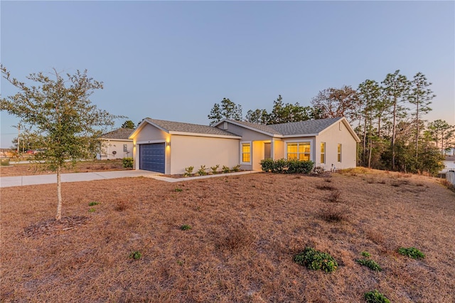 single story home with a garage