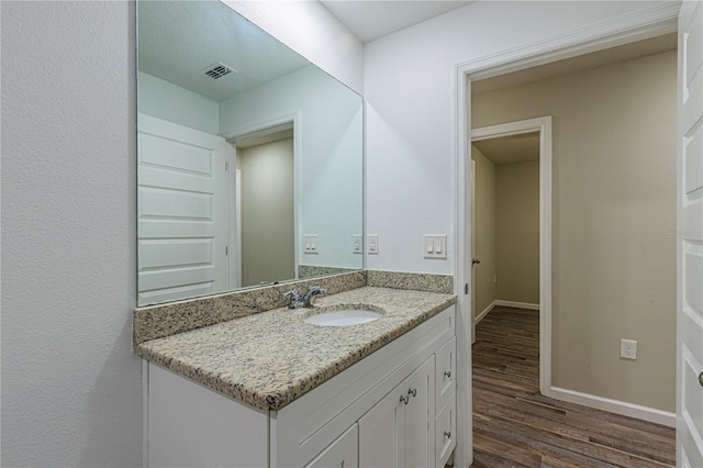 bathroom with wood-type flooring and vanity