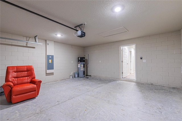 garage featuring a garage door opener, hybrid water heater, and electric panel