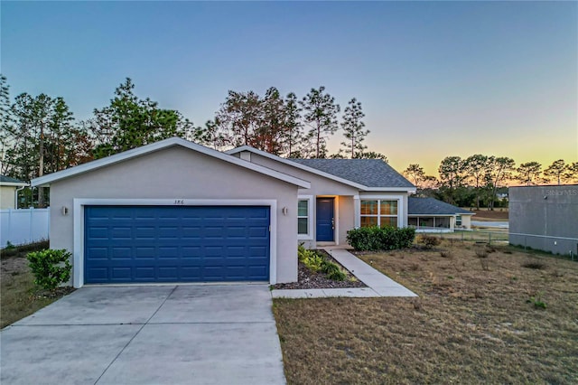 view of front of property with a garage