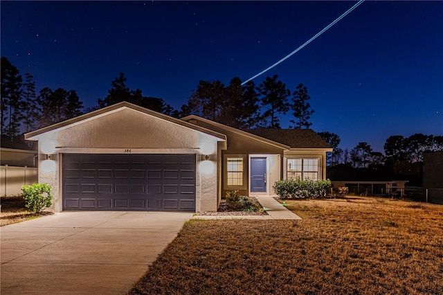 single story home featuring a garage