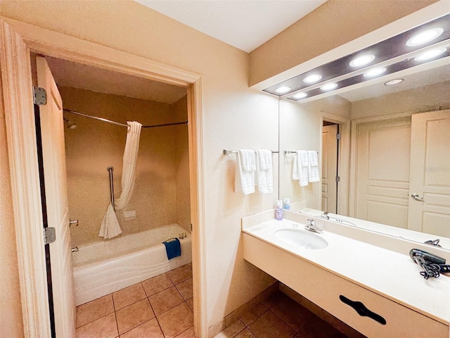 bathroom featuring shower / tub combo with curtain, tile patterned flooring, and sink