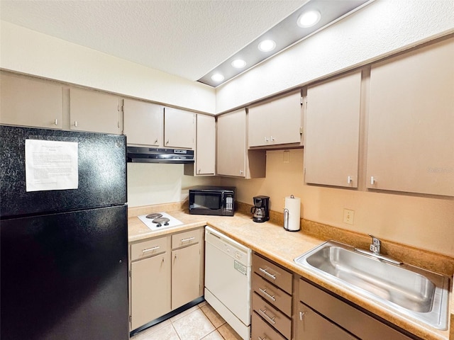 kitchen with light tile patterned floors, sink, a textured ceiling, and black appliances