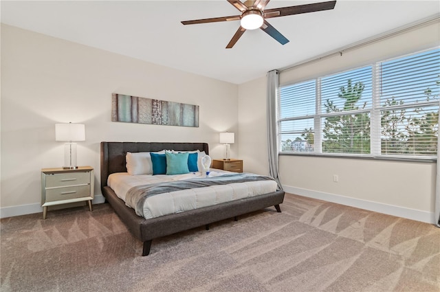 bedroom with ceiling fan and carpet