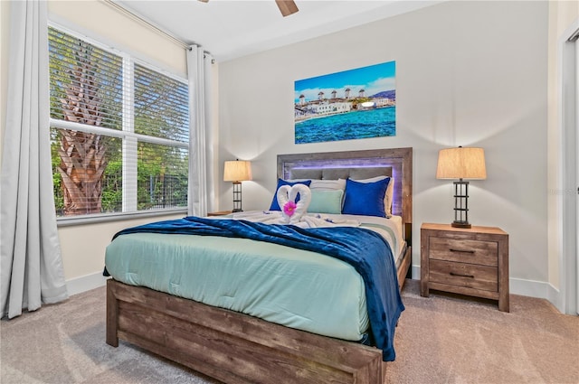 bedroom featuring ceiling fan and carpet