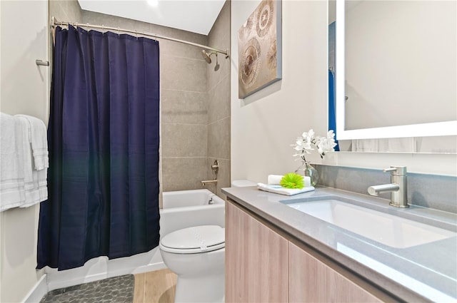 full bathroom featuring vanity, toilet, and shower / bath combo with shower curtain