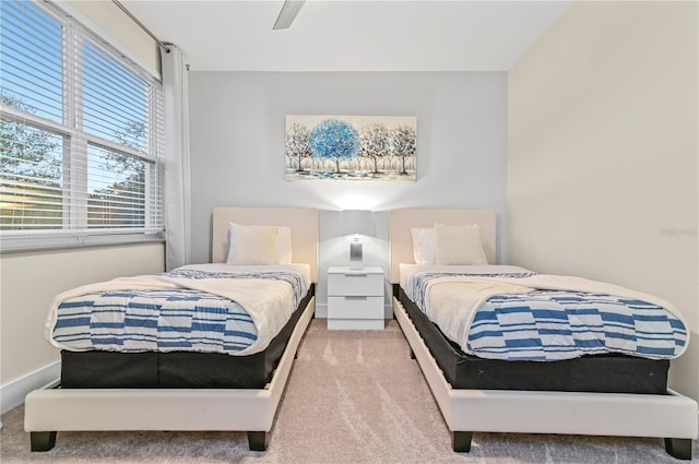 bedroom with ceiling fan and carpet