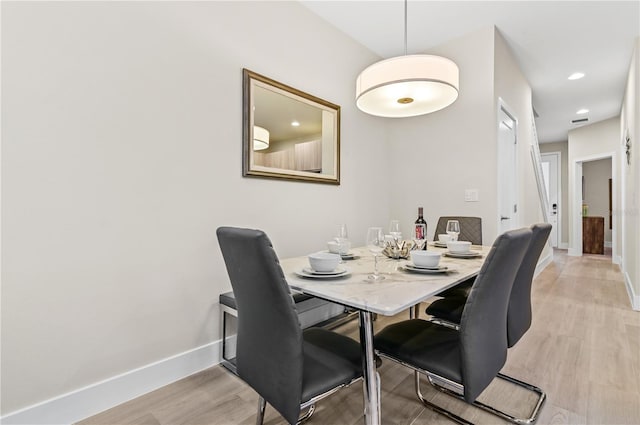 dining space featuring light hardwood / wood-style flooring