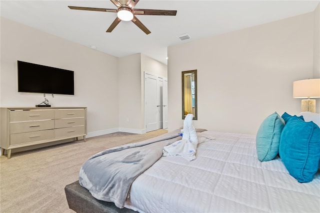 bedroom with light carpet and ceiling fan