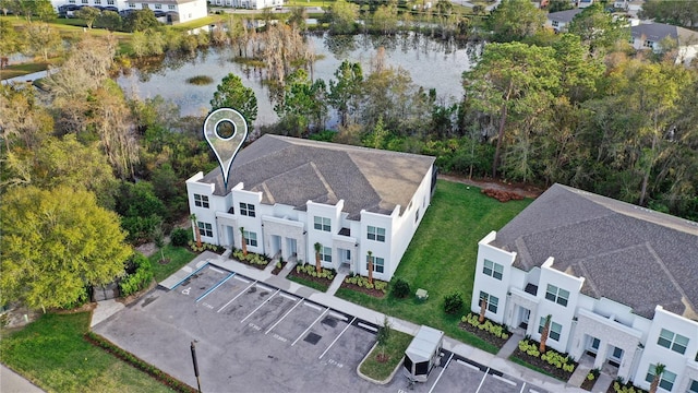 birds eye view of property with a water view