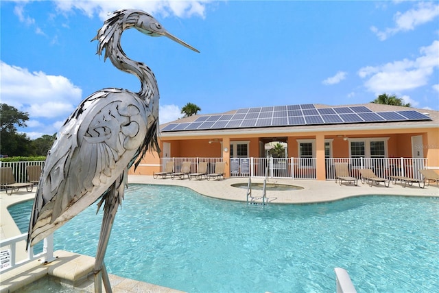 view of swimming pool featuring a patio area