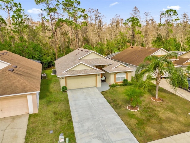 view of front of property featuring a garage and a front yard