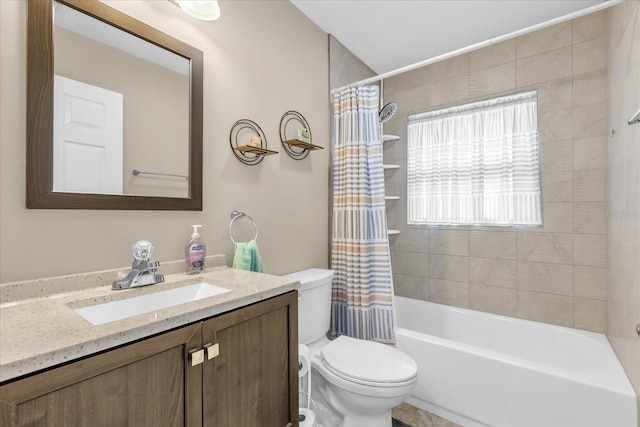 full bathroom with vanity, shower / bath combination with curtain, and toilet