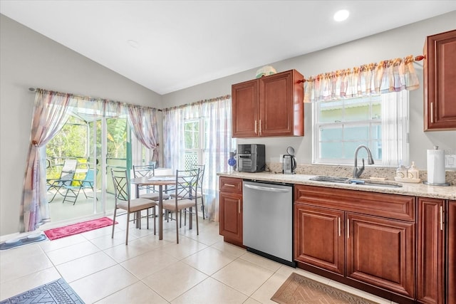 kitchen featuring sink, vaulted ceiling, light stone countertops, and dishwasher