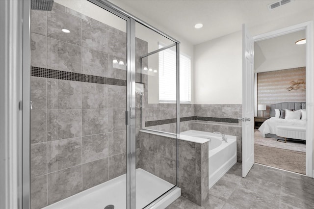 bathroom with separate shower and tub