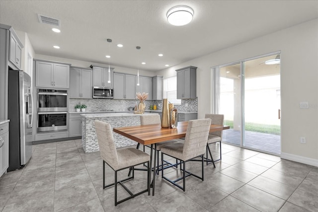 dining room with light tile patterned floors