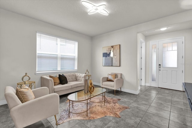 tiled living room with a textured ceiling