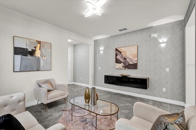 living room with a textured ceiling