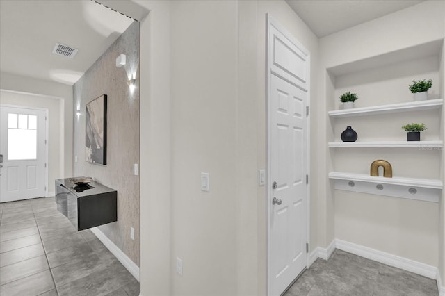 entrance foyer featuring light tile patterned floors