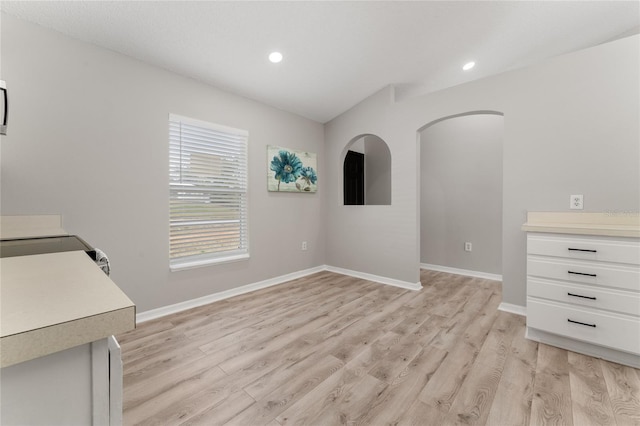 unfurnished dining area with light wood-type flooring