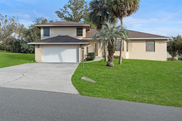 view of front of house with a garage and a front yard