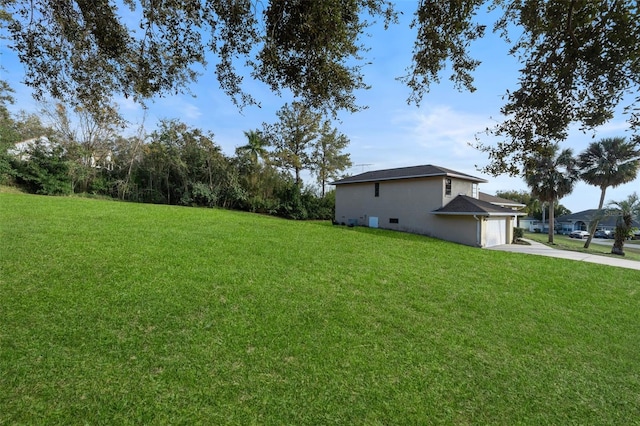 view of yard with a garage