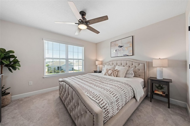 bedroom featuring ceiling fan and light colored carpet