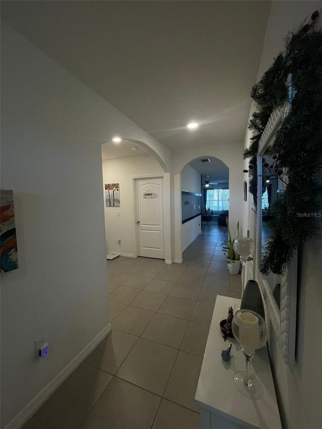 corridor with light tile patterned floors