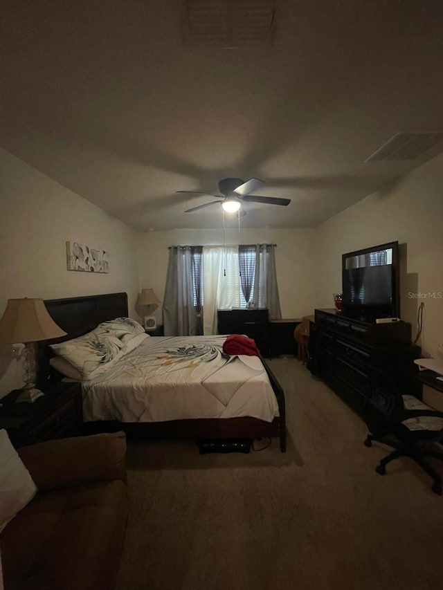 carpeted bedroom with ceiling fan