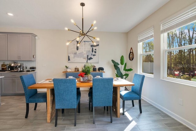 dining area featuring a notable chandelier