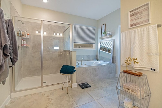 bathroom featuring tile patterned flooring and separate shower and tub