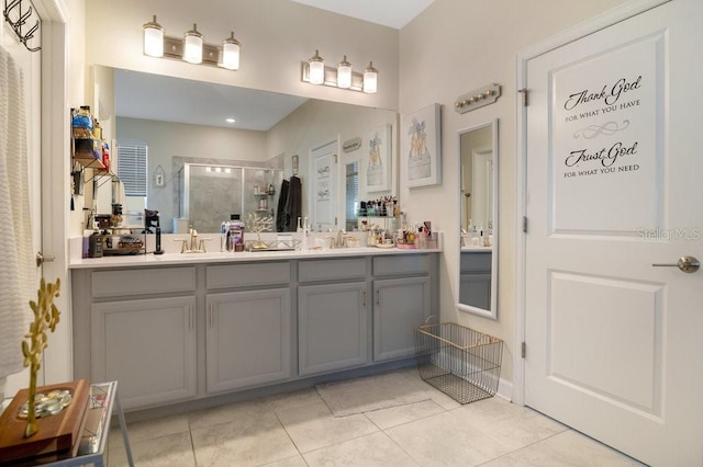 bathroom featuring tile patterned floors, vanity, and an enclosed shower