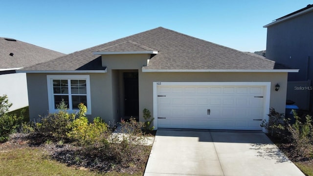 ranch-style home featuring a garage