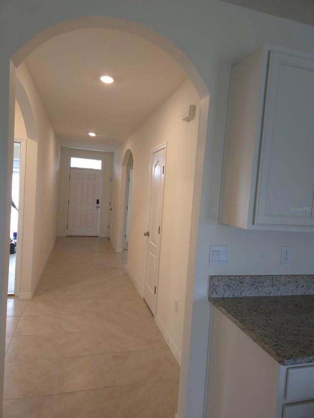 hallway with light tile patterned floors