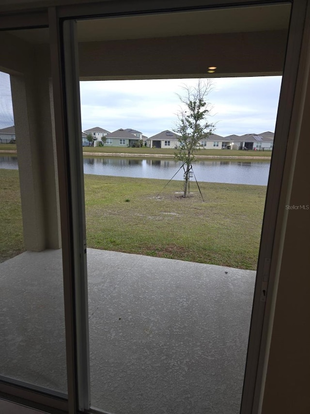 doorway to outside featuring a water view