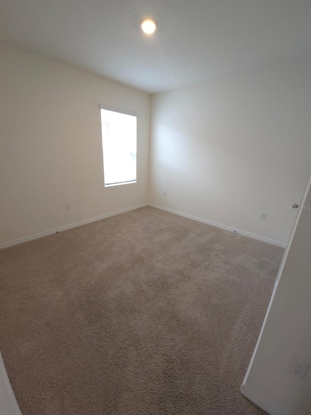 view of carpeted spare room