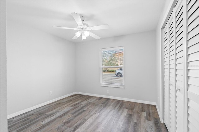 spare room featuring hardwood / wood-style flooring and ceiling fan