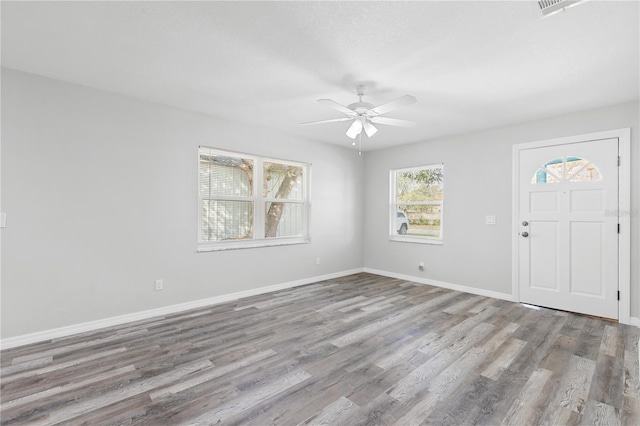 foyer entrance featuring ceiling fan and light wood-type flooring