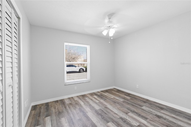 empty room featuring wood-type flooring and ceiling fan