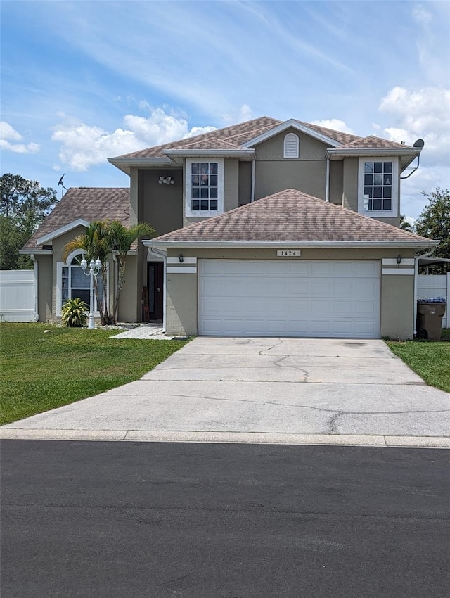 front facade with a garage and a front lawn