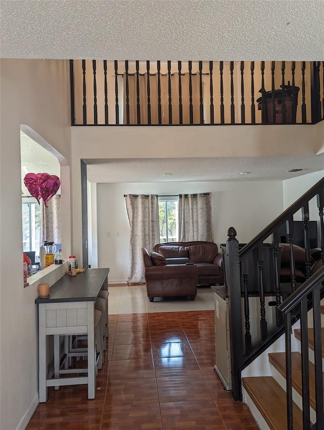 interior space featuring tile patterned floors and a textured ceiling