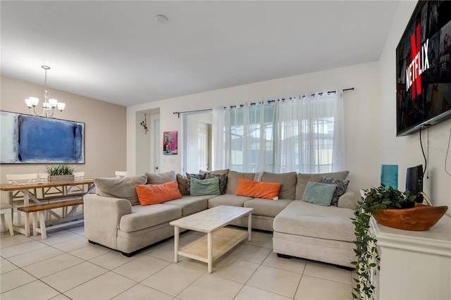 living room featuring light tile patterned flooring and a notable chandelier