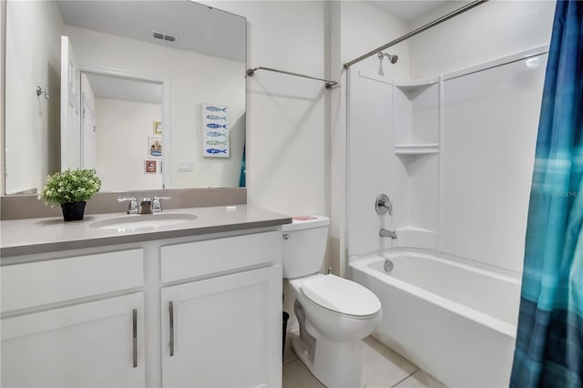 bathroom featuring toilet, vanity, visible vents, tile patterned floors, and shower / bath combo