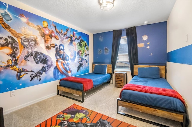 bedroom with carpet, baseboards, and a textured ceiling