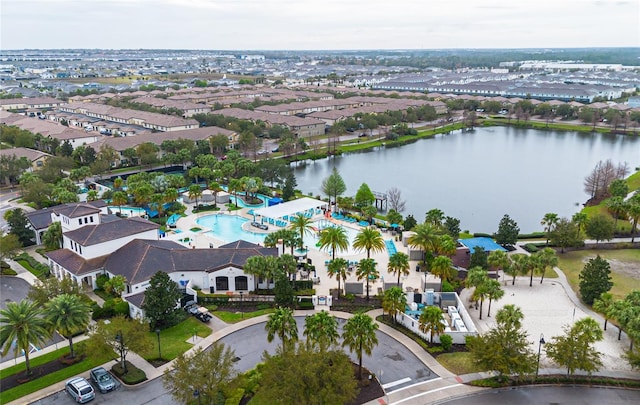 drone / aerial view featuring a water view and a residential view