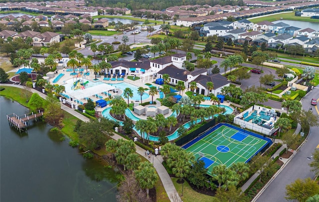 birds eye view of property featuring a water view and a residential view