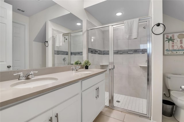 2186 Fleming Mist Pl, Kissimmee, FL 34747 - bathroom with double vanity, a shower stall, tile patterned floors, and recessed lighting